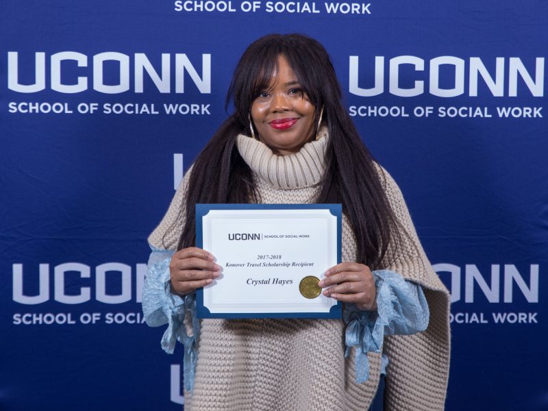 Student holding scholarship certificate