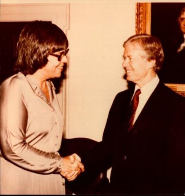 Nancy A. Humphreys shaking hands with President Jimmy Carter