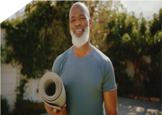 Older African American male standing outdoors