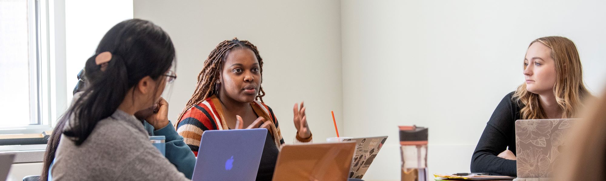 Black female MSW student talking in class