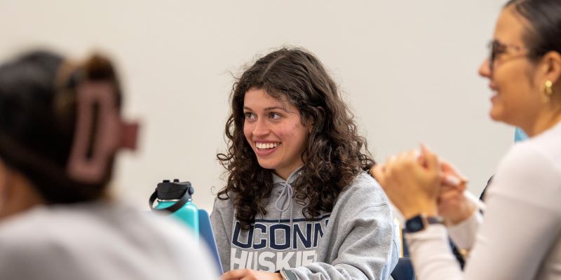 female MSW student smiling in class